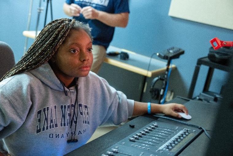 A student mixes music in a Washington College studio